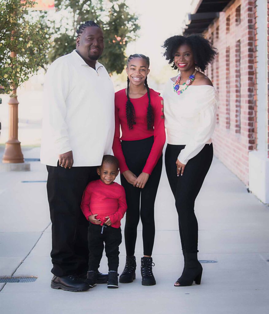 family photo of dr. ross, her husband, daughter, and son