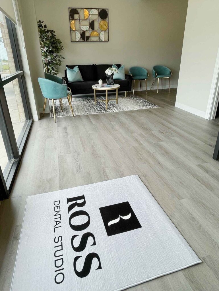 lobby with a floor mat with a Ross Dental Studio logo on it in the foreground
